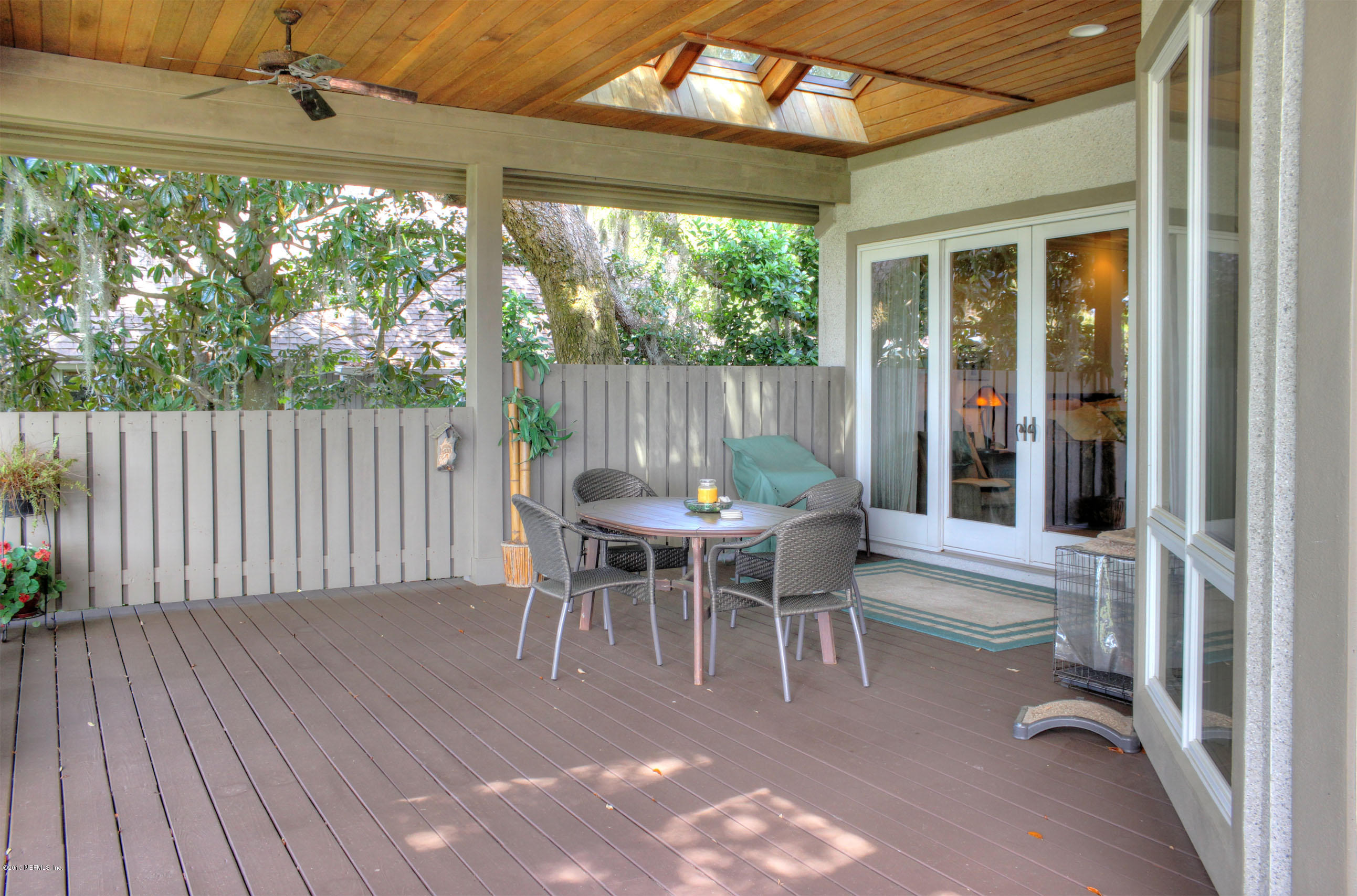 22 Sea Marsh Road Fernandina Beach, FL 32034 - Photo 11 of 24 a dining room with furniture and a garden