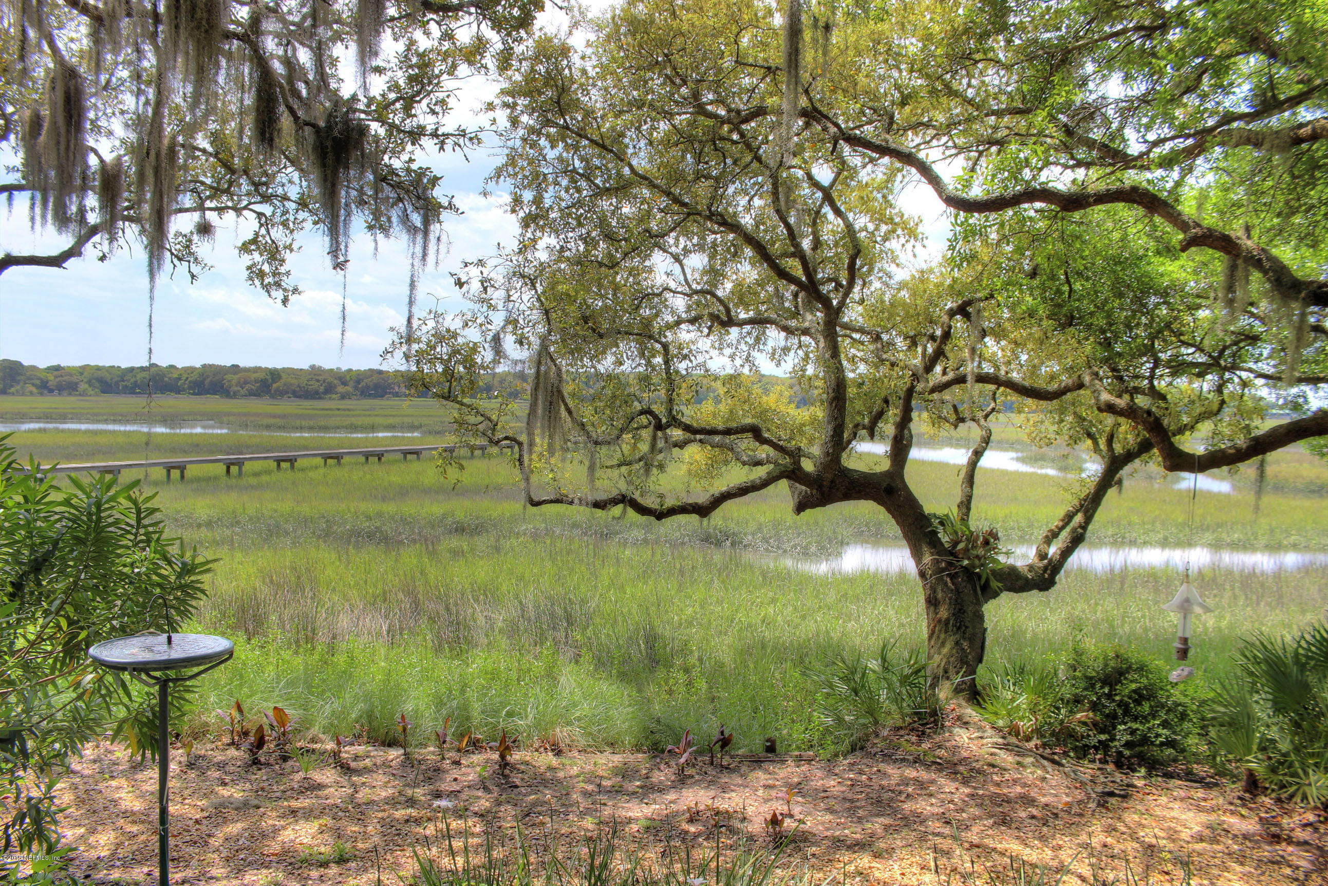22 Sea Marsh Road Fernandina Beach, FL 32034 - Photo 12 of 24 a view of a lake with a yard