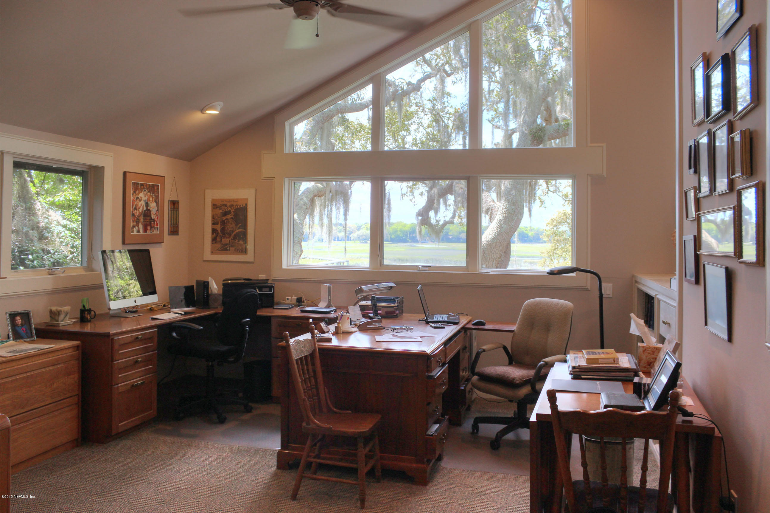 22 Sea Marsh Road Fernandina Beach, FL 32034 - Photo 15 of 24 a view of a dining room with furniture window and wooden floor
