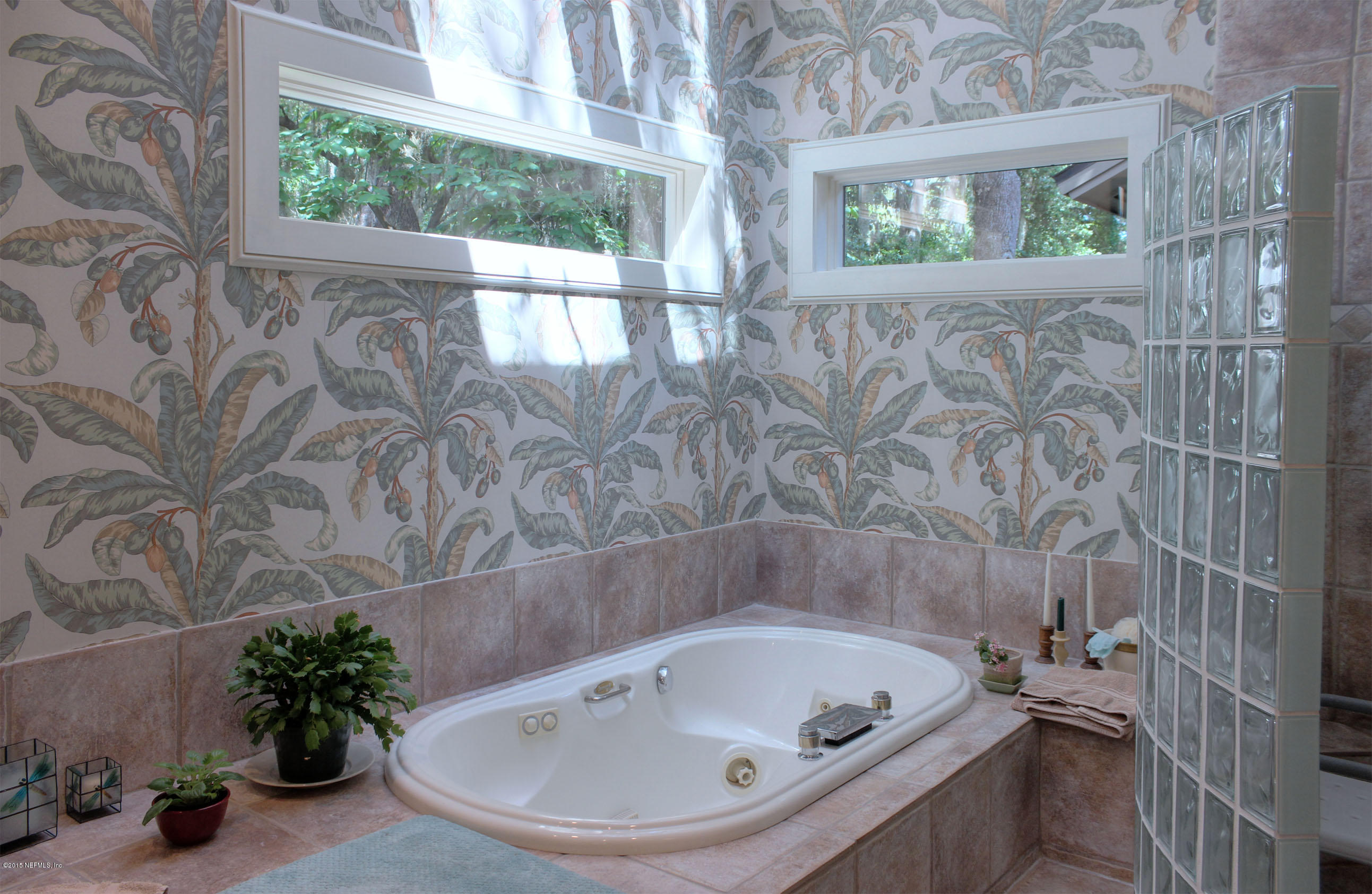 22 Sea Marsh Road Fernandina Beach, FL 32034 - Photo 18 of 24 a bathroom with a tub and sink