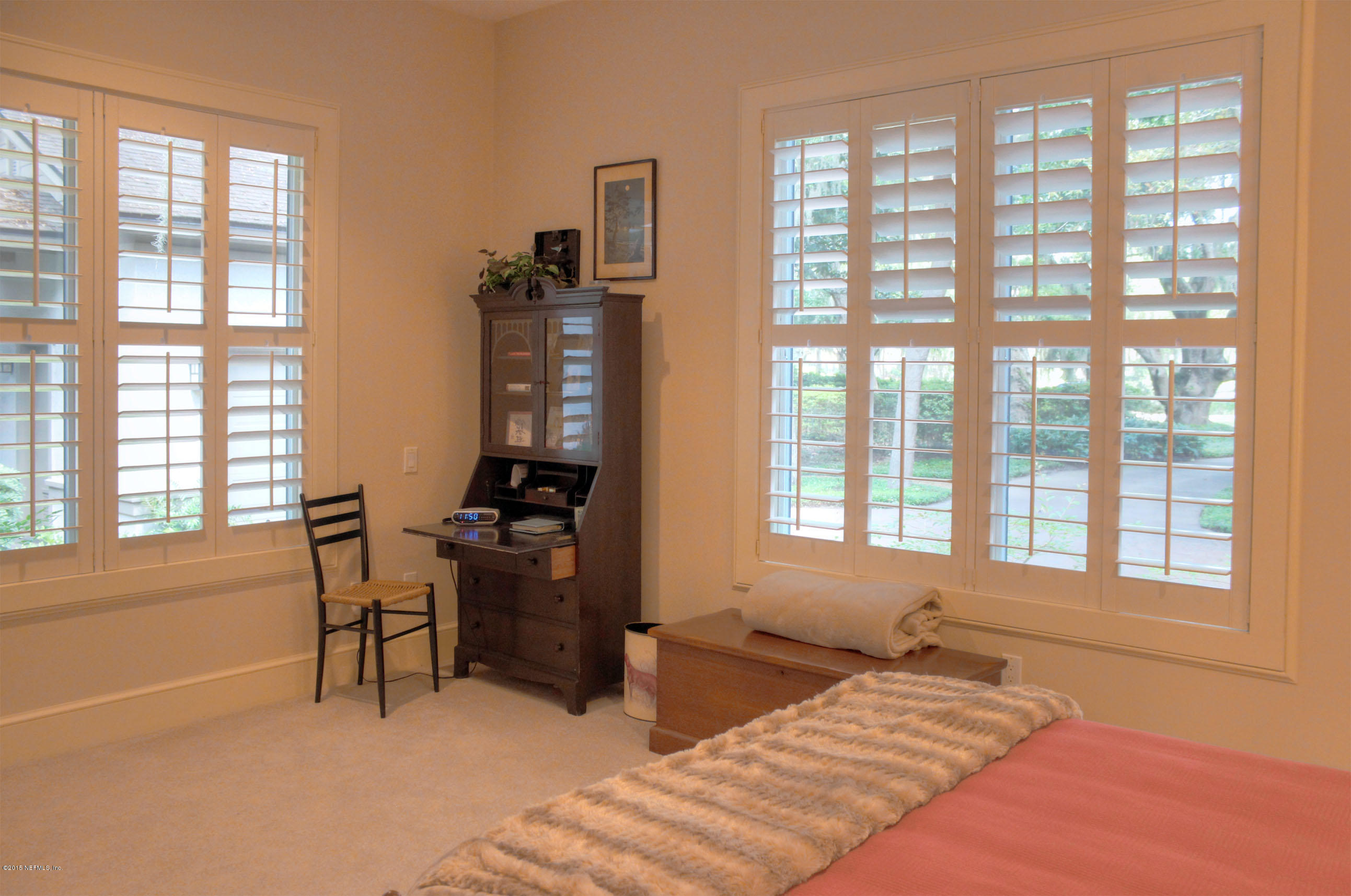 22 Sea Marsh Road Fernandina Beach, FL 32034 - Photo 23 of 24 a bedroom with a bed and a window