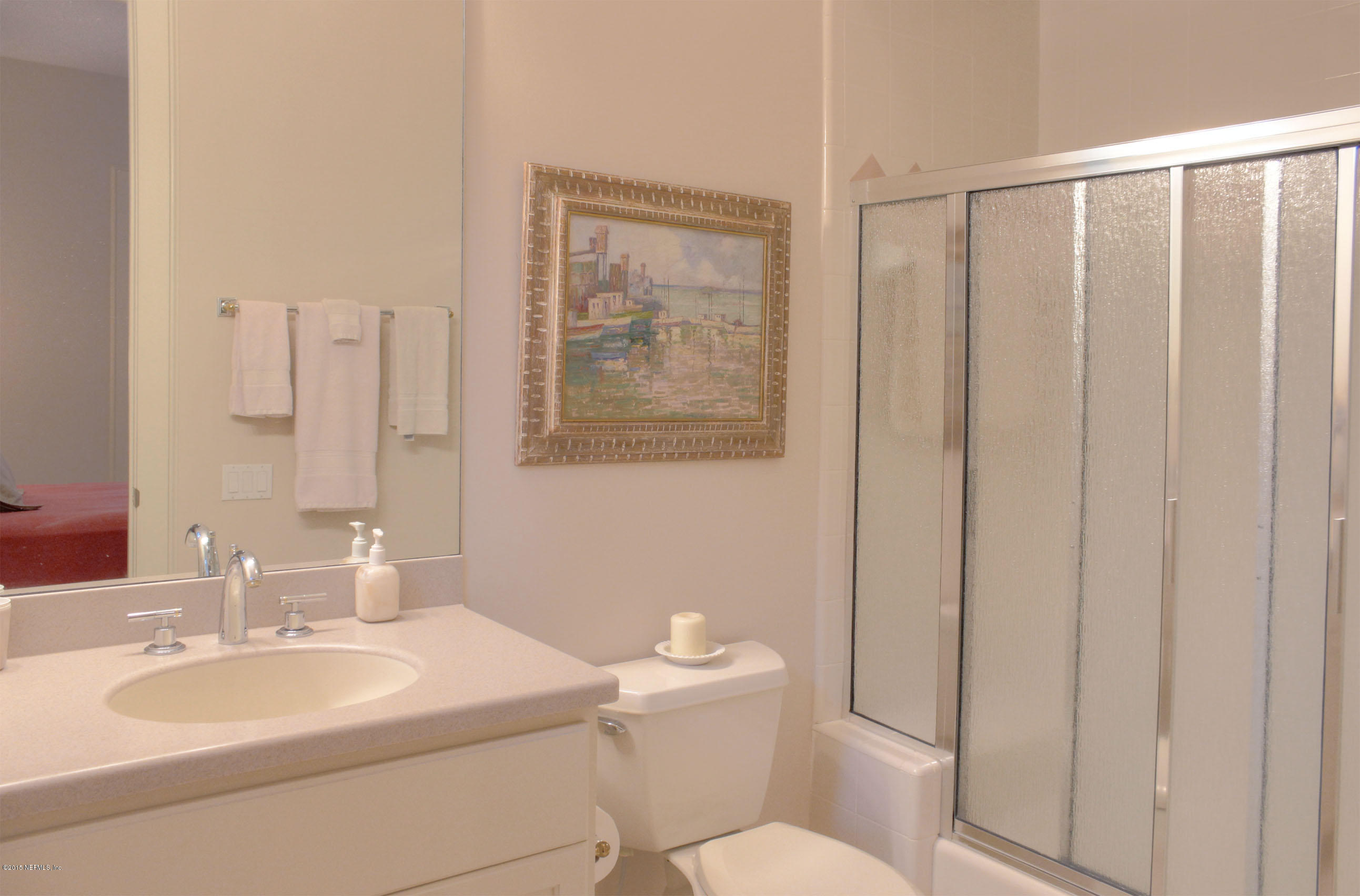 22 Sea Marsh Road Fernandina Beach, FL 32034 - Photo 24 of 24 a bathroom with a toilet a sink and mirror