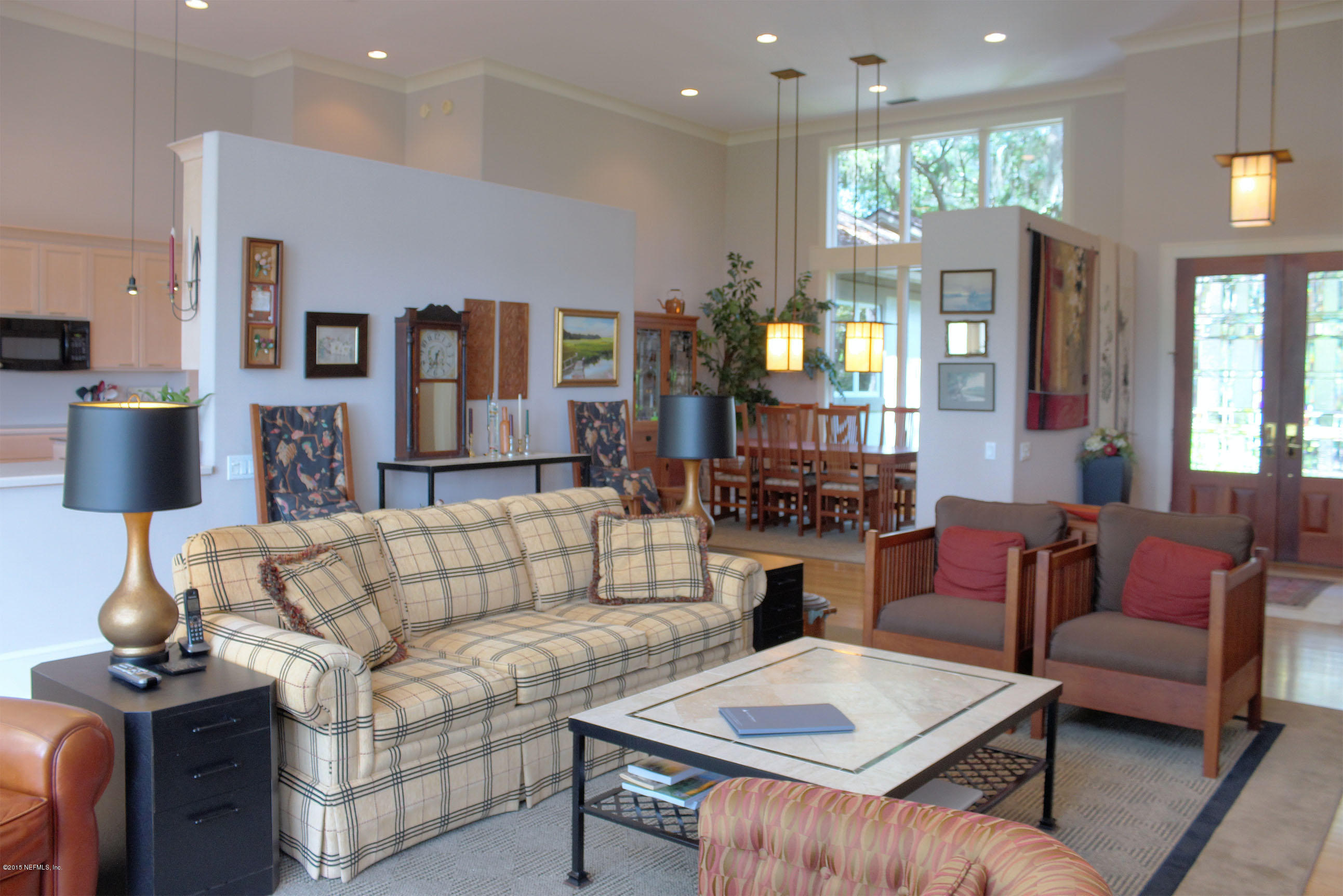 22 Sea Marsh Road Fernandina Beach, FL 32034 - Photo 5 of 24 a living room with furniture and a lamp