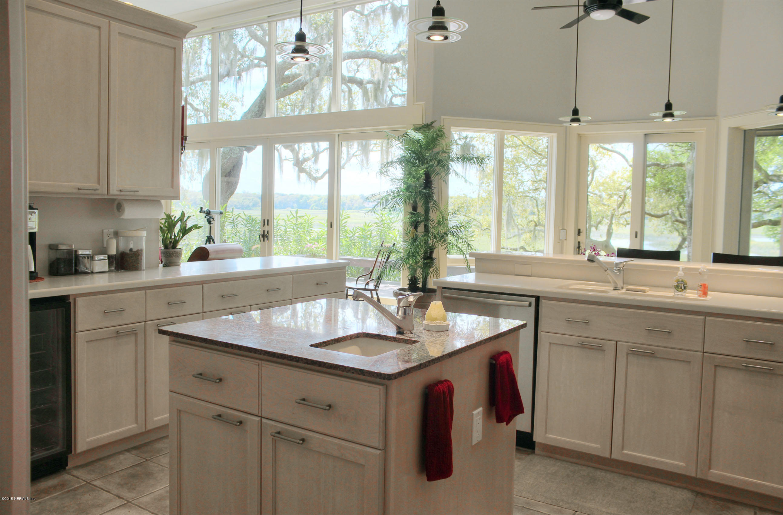 22 Sea Marsh Road Fernandina Beach, FL 32034 - Photo 8 of 24 a kitchen with a sink stove and window
