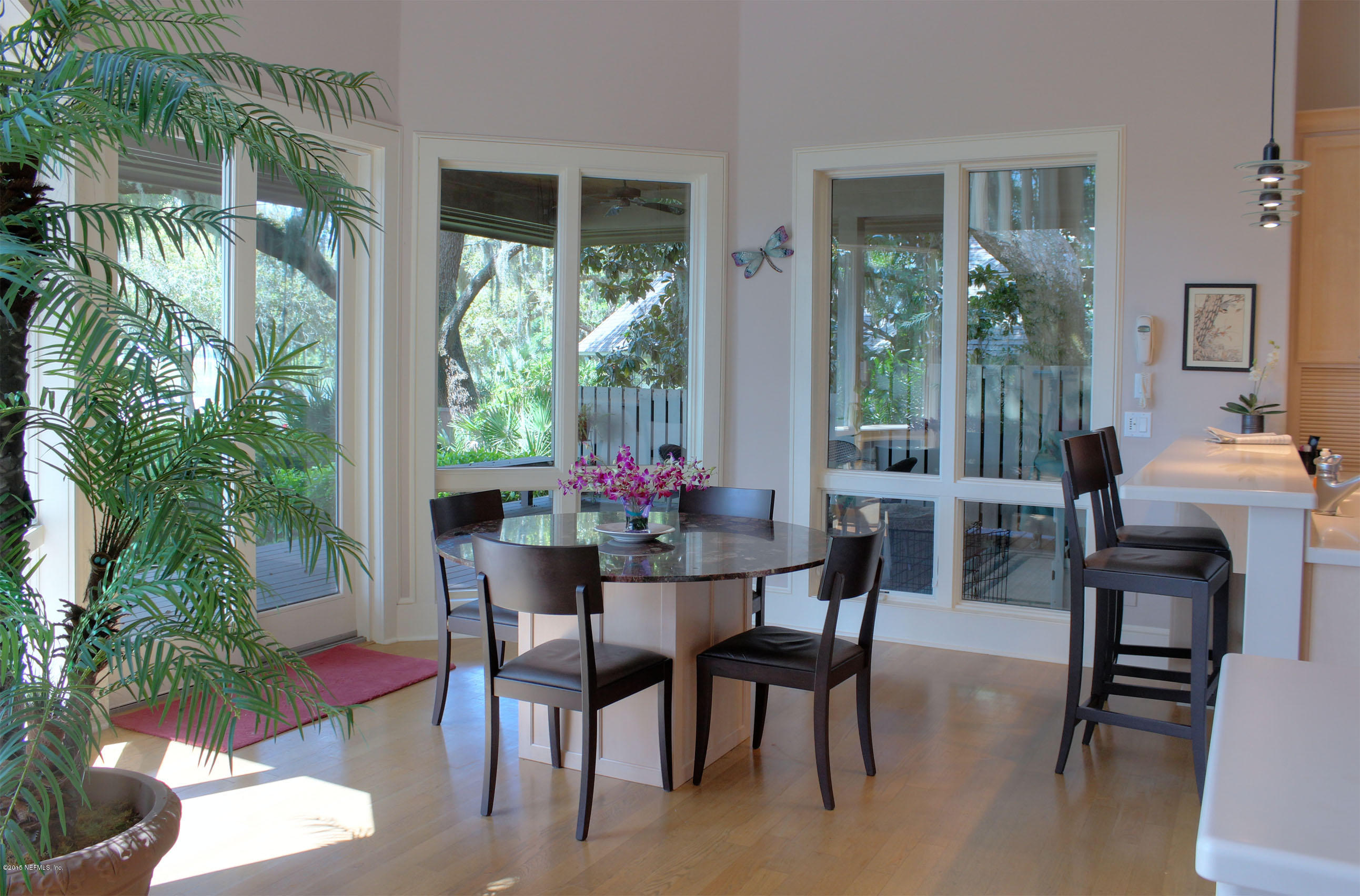 22 Sea Marsh Road Fernandina Beach, FL 32034 - Photo 9 of 24 a view of a dining room with furniture and garden view