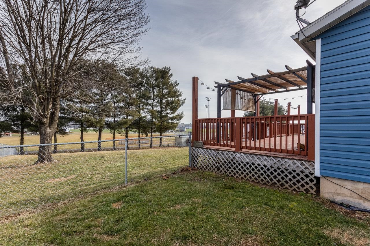 4906 Ottobine Road Dayton, VA 22821 - Photo 3 of 24 a view of a yard with wooden fence and trees