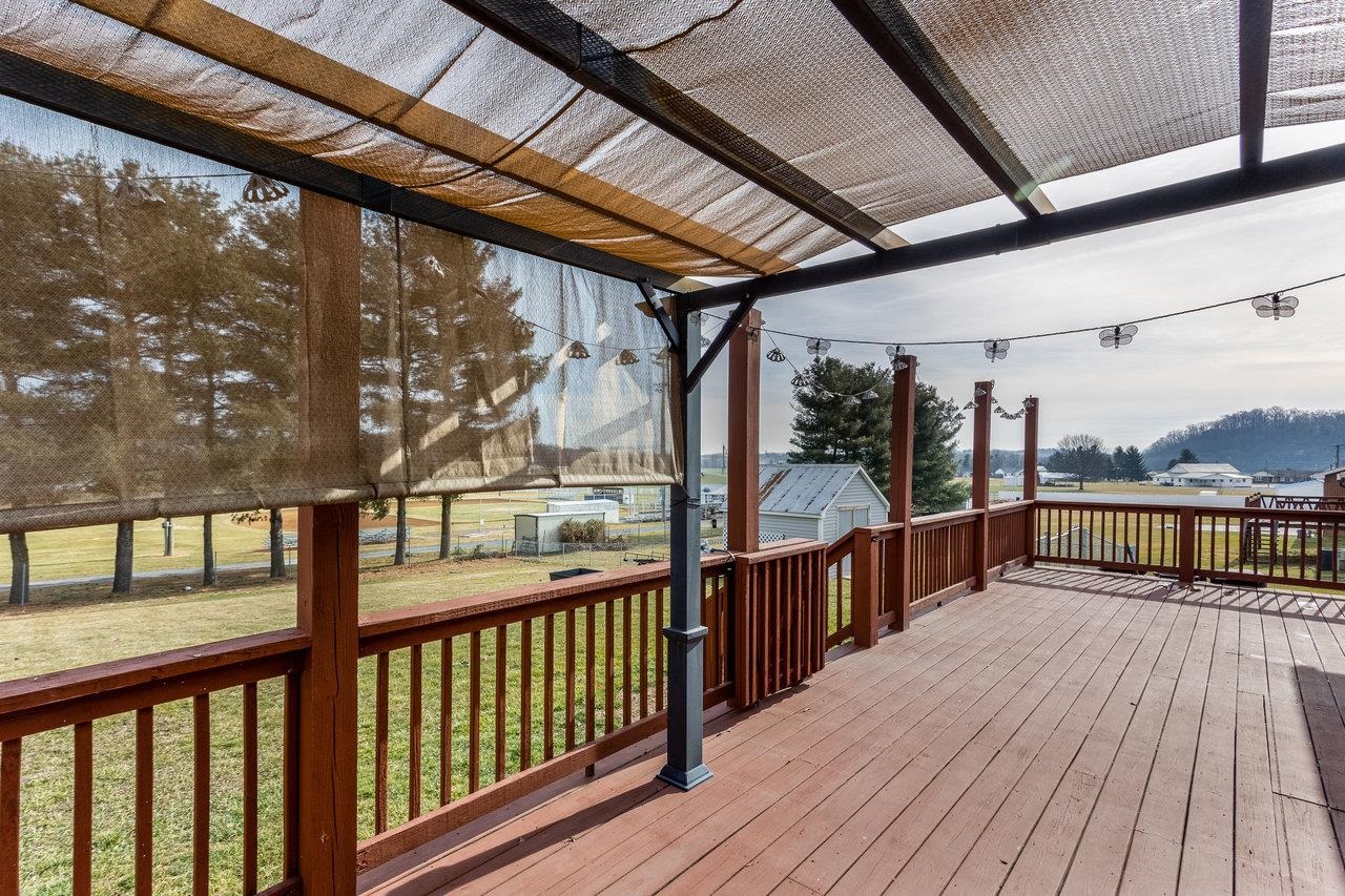 4906 Ottobine Road Dayton, VA 22821 - Photo 4 of 24 a view of a balcony with wooden floor