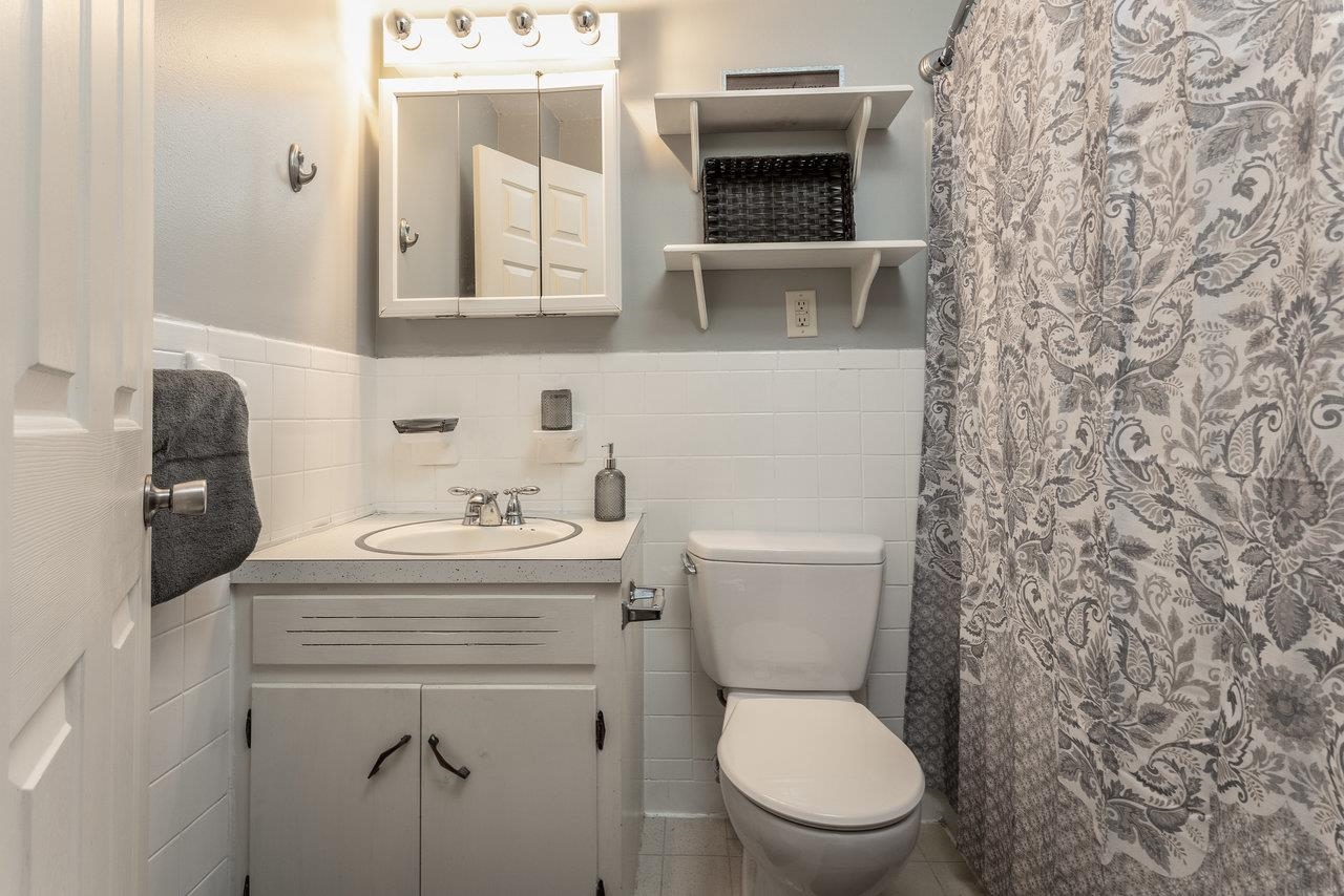 4906 Ottobine Road Dayton, VA 22821 - Photo 9 of 24 a bathroom with a toilet a sink and mirror