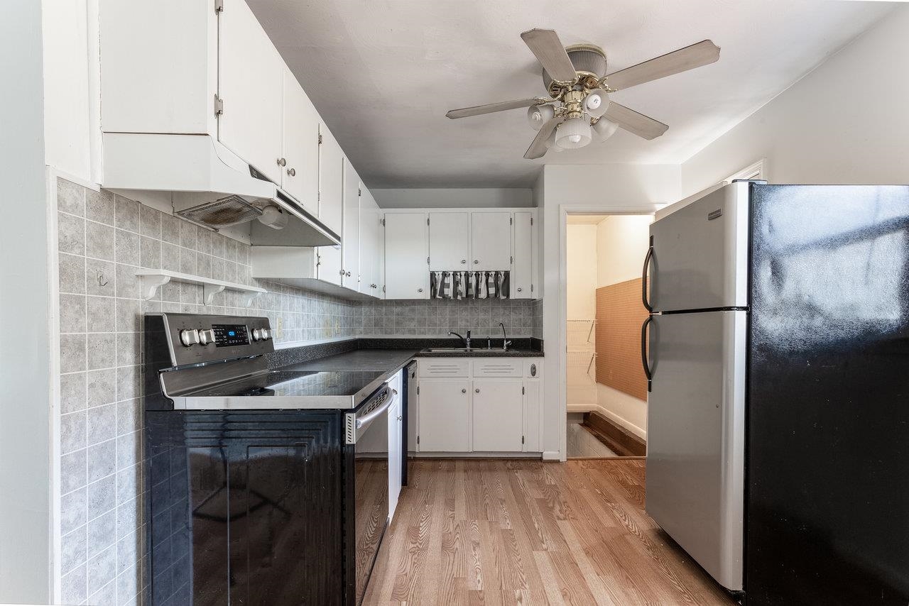 4906 Ottobine Road Dayton, VA 22821 - Photo 10 of 24 a kitchen with stainless steel appliances granite countertop a sink a stove a refrigerator and cabinets