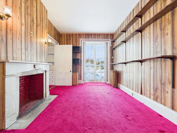 a view of livingroom with furniture and floor to ceiling window