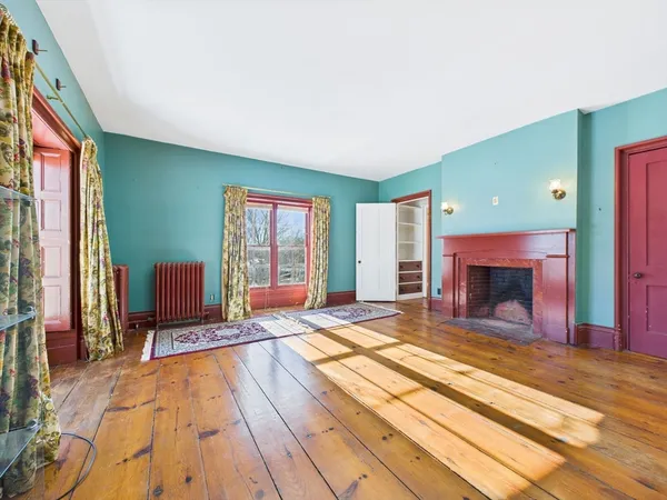 a living room with a rug and a rug