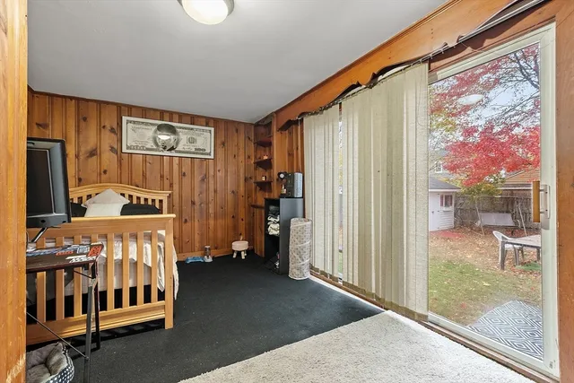 a bedroom with furniture and a window