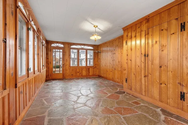 a view of a hallway with windows
