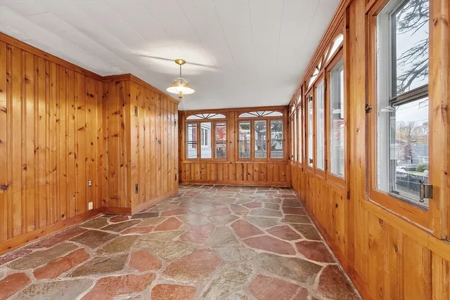 a view of a hallway with windows