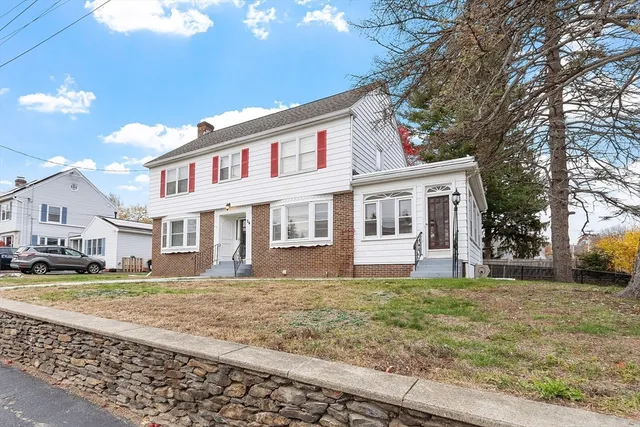 a front view of a house with a yard