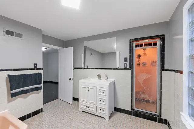 a bathroom with a sink and a mirror