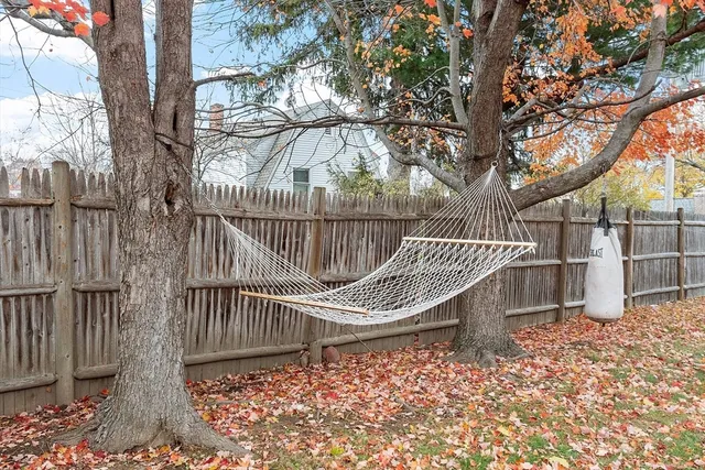 a view of stairs and patio with wooden fence
