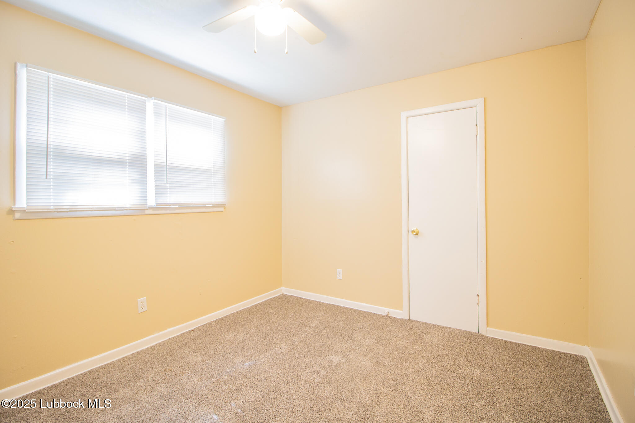 2414 38th Street Lubbock, TX 79412 - Photo 16 of 20 a view of an empty room with a window