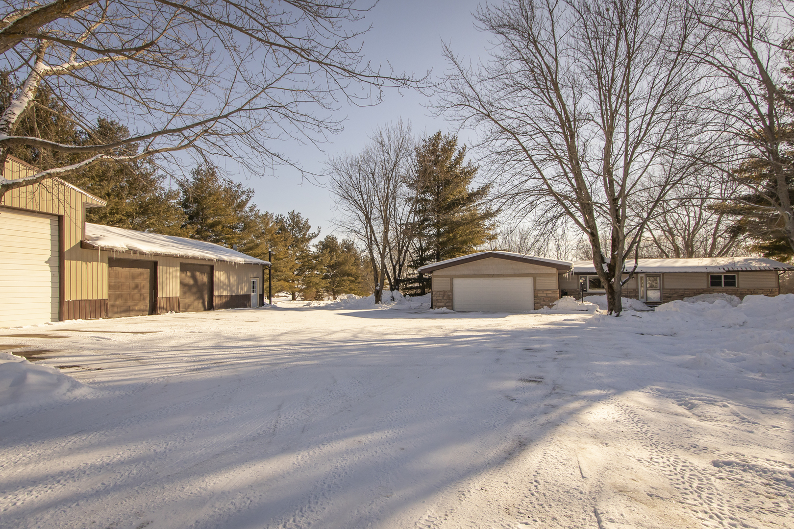 6546 Cherry Valley Road Kingston, IL 60145 - Photo 2 of 51 a view of a house with a yard covered in snow