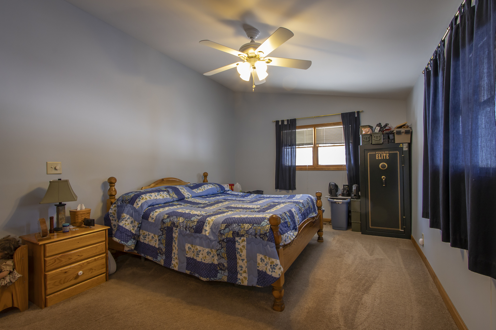 6546 Cherry Valley Road Kingston, IL 60145 - Photo 19 of 51 a bedroom with a bed and a chandelier