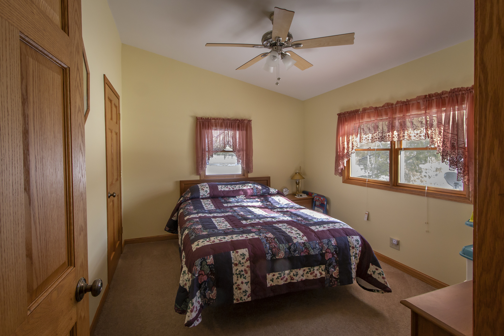 6546 Cherry Valley Road Kingston, IL 60145 - Photo 22 of 51 a bedroom with a bed and a chandelier