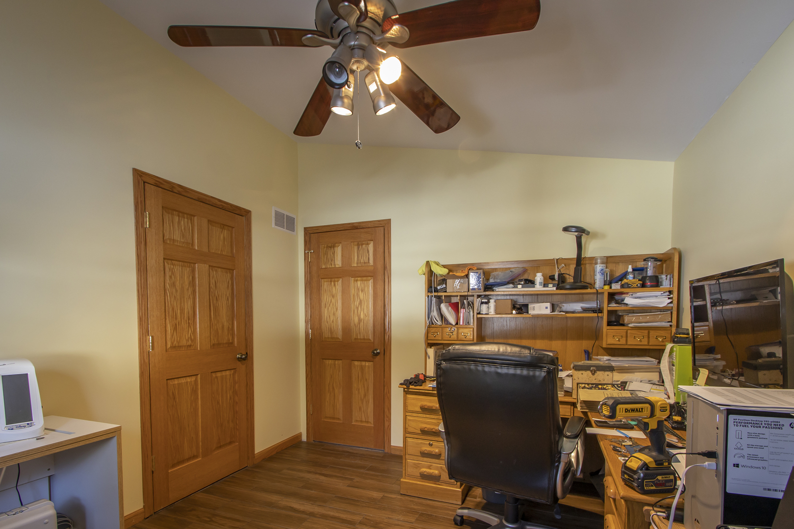 6546 Cherry Valley Road Kingston, IL 60145 - Photo 24 of 51 a view of a workspace with furniture and a flat screen tv