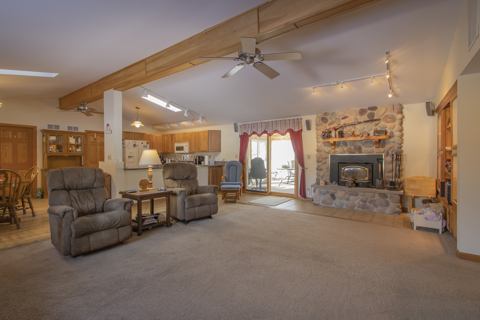 6546 Cherry Valley Road Kingston, IL 60145 - Photo 5 of 51 a living room with furniture and a fireplace