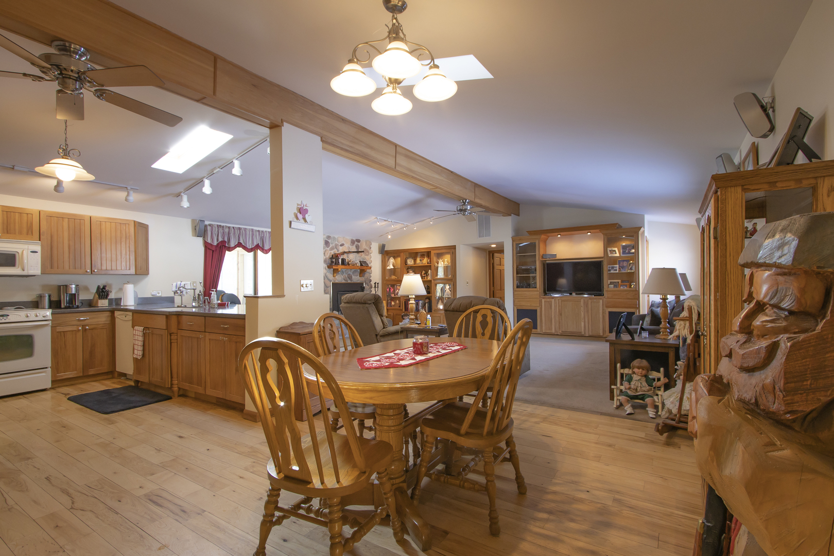 6546 Cherry Valley Road Kingston, IL 60145 - Photo 6 of 51 a view of a dining room with furniture and a chandelier