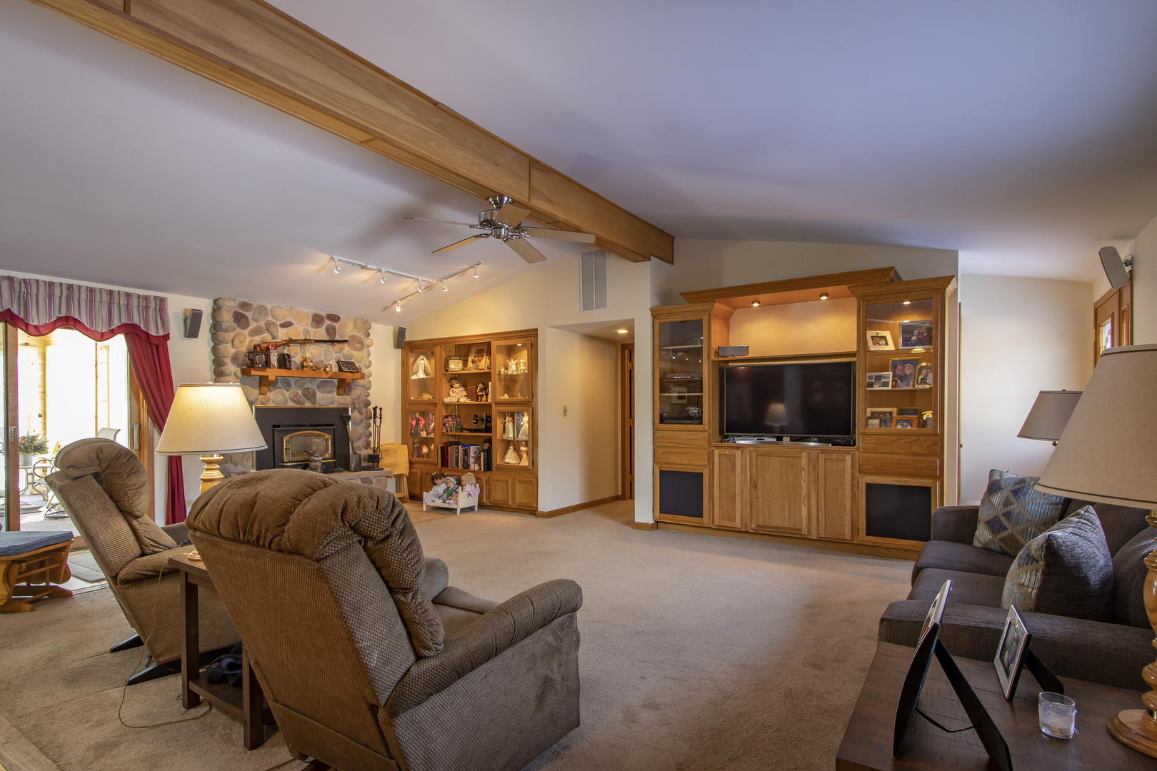 6546 Cherry Valley Road Kingston, IL 60145 - Photo 10 of 51 a living room with furniture and a flat screen tv