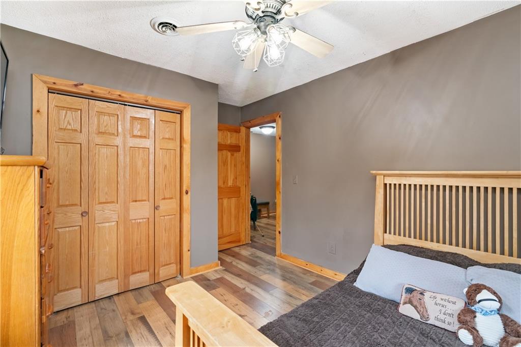 1316 Porter Road Harrisville, PA 16038 - Photo 12 of 37 an empty room with wooden floor closet and windows