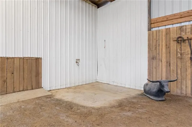 a view of an empty room with a wooden door