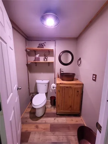 a bathroom with a toilet and a sink