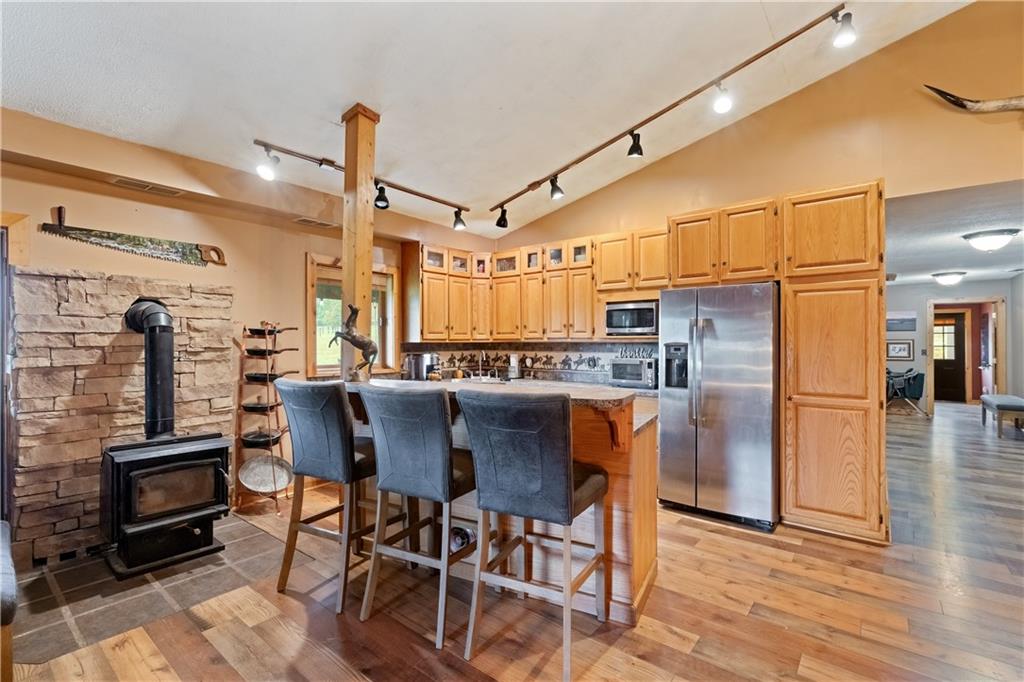 1316 Porter Road Harrisville, PA 16038 - Photo 2 of 37 a dining table with chairs and kitchen view