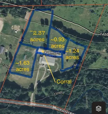 a sign broad on a pole on a street