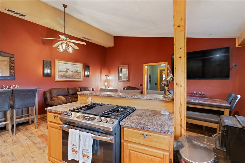 1316 Porter Road Harrisville, PA 16038 - Photo 5 of 37 a kitchen with a stove and a flat screen tv
