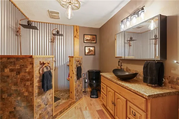 a kitchen with a sink a refrigerator and cabinets
