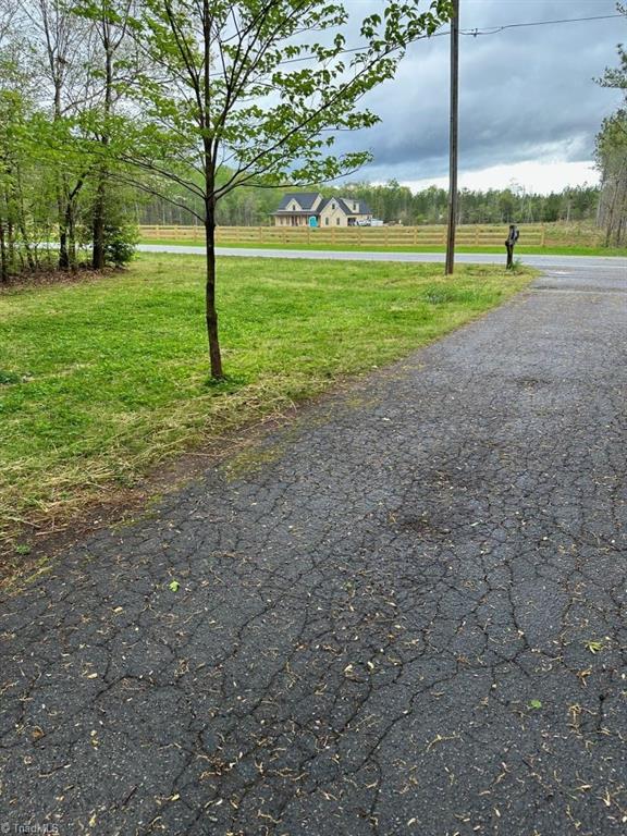 173 Junction Road Mocksville, NC 27028 - Photo 17 of 23 Looking from the driveway across Junction Rd you can see a new home bring built at a distance. This just shows the privacy offered in this property