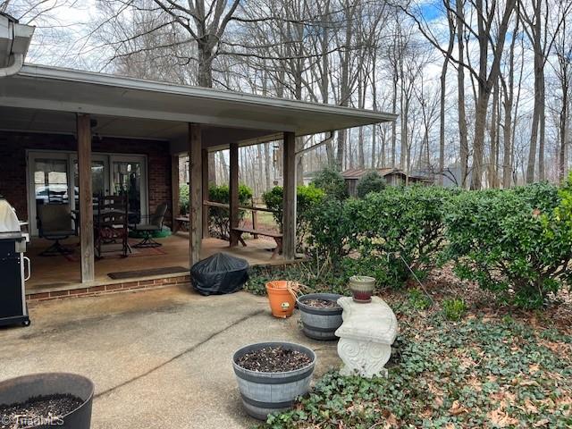 173 Junction Road Mocksville, NC 27028 - Photo 21 of 23 Step onto the covered patio from the yard or enter from the sunroom> A great place for a family gathering.