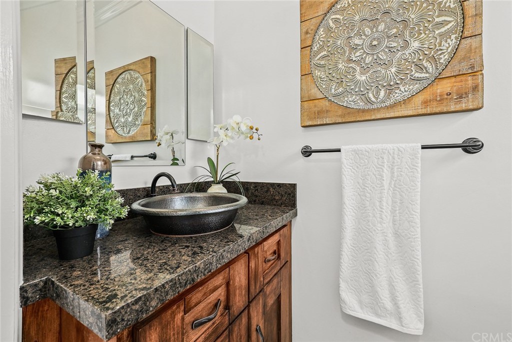1183 Menlo Drive Altadena, CA 91001 - Photo 16 of 34 a bathroom with a granite countertop sink and a mirror