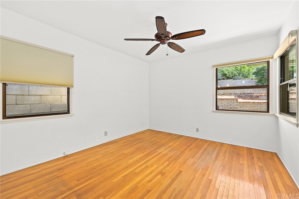 1183 Menlo Drive Altadena, CA 91001 - Photo 18 of 34 a view of a big room with wooden floor and windows