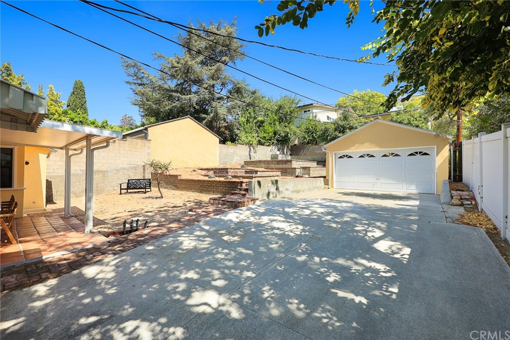 1183 Menlo Drive Altadena, CA 91001 - Photo 29 of 34 a front view of a house with a yard