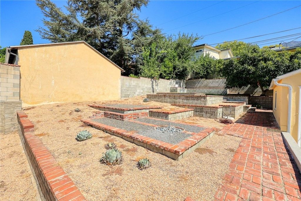 1183 Menlo Drive Altadena, CA 91001 - Photo 31 of 34 a view of a swimming pool with a patio