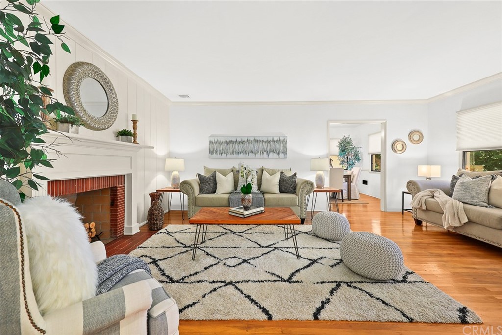 1183 Menlo Drive Altadena, CA 91001 - Photo 7 of 34 a living room with furniture a fireplace and a large window