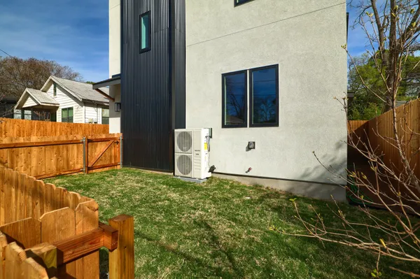 a blue bench sitting in front of a building
