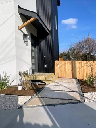 a large kitchen with stainless steel appliances kitchen island granite countertop a stove a sink and a refrigerator