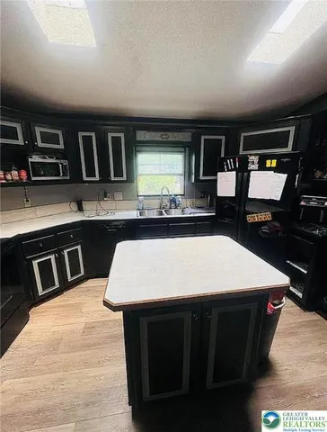 a kitchen with a stove and a refrigerator
