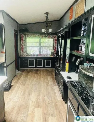 a kitchen with stainless steel appliances granite countertop a stove and a refrigerator
