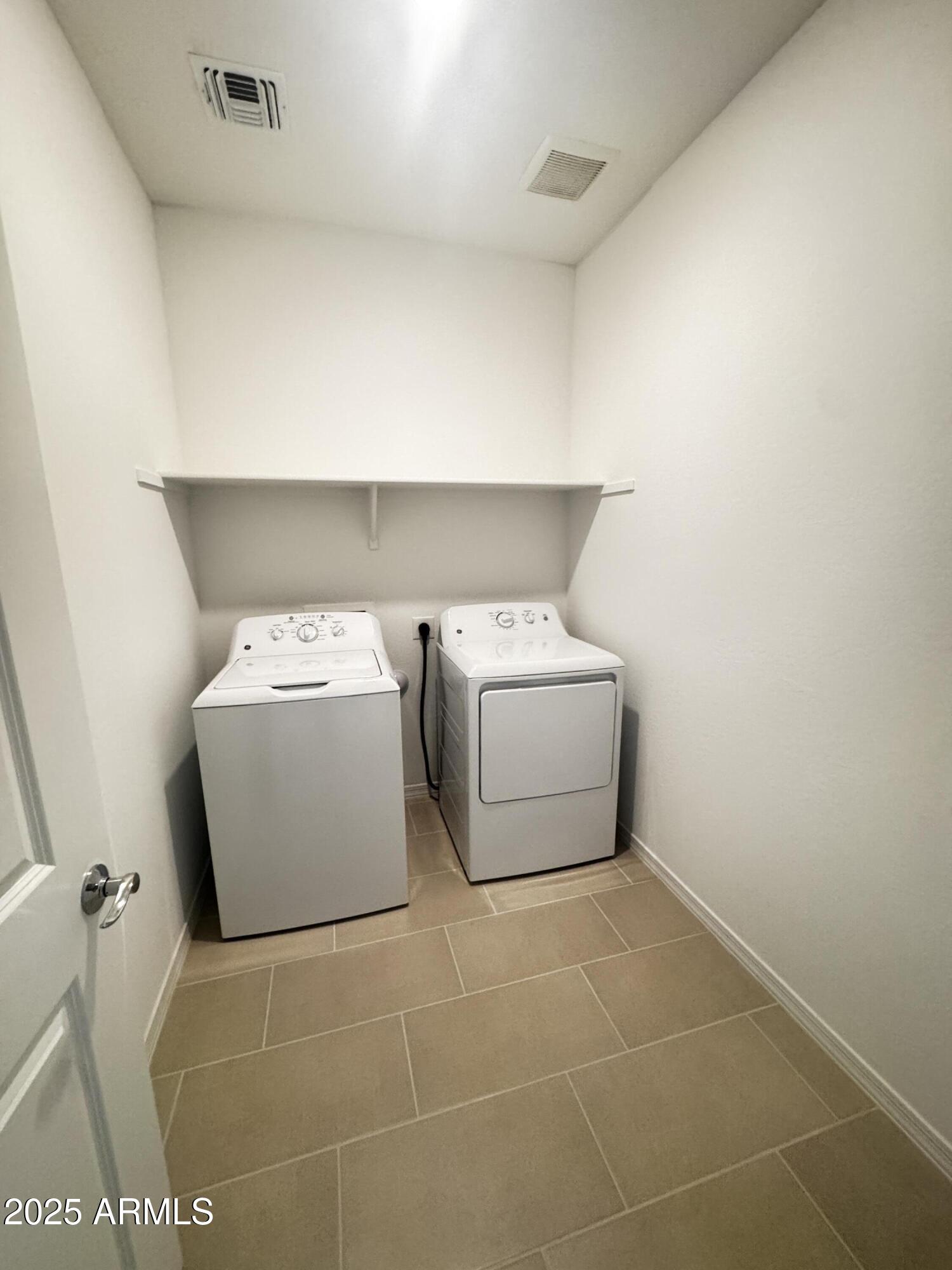 9957 West Mitchell Avenue Avondale, AZ 85392 - Photo 11 of 19 a utility room with dryer and washer