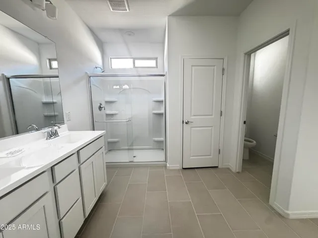a large white kitchen with a sink