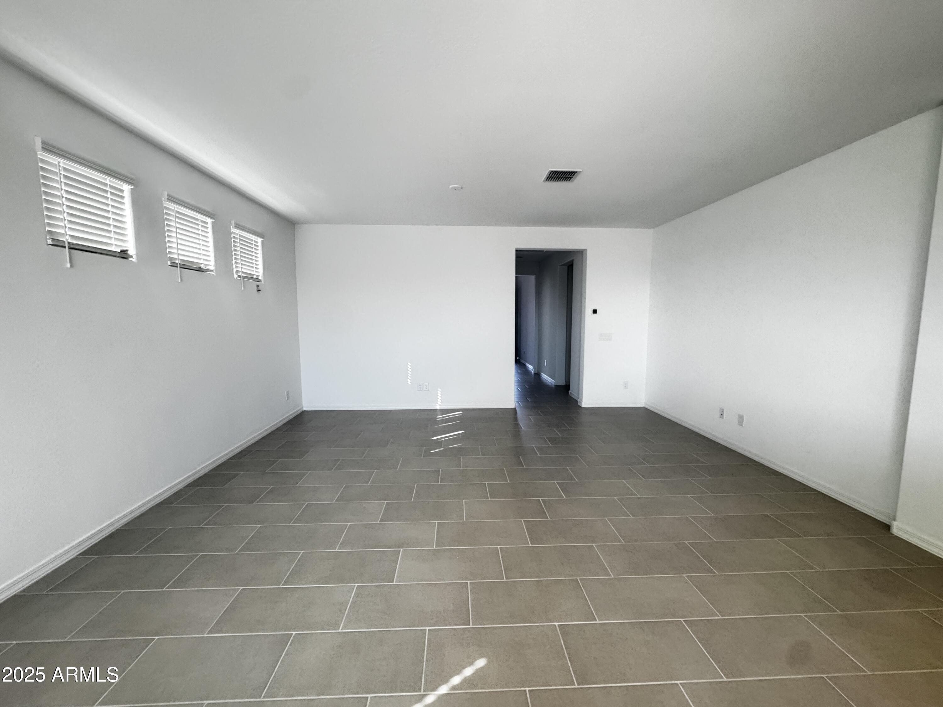 9957 West Mitchell Avenue Avondale, AZ 85392 - Photo 15 of 19 a view of an empty room with a window